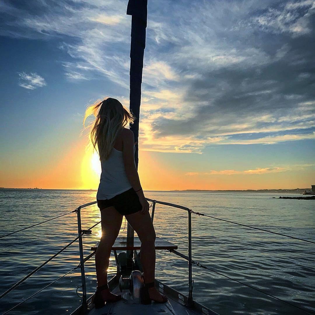 Sailing on the Tagus River at the sunset is a unique experience. The city changes color