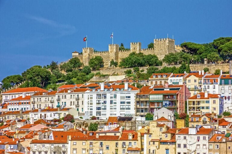 Explore the impressive São Jorge Castle. As you climb the hills