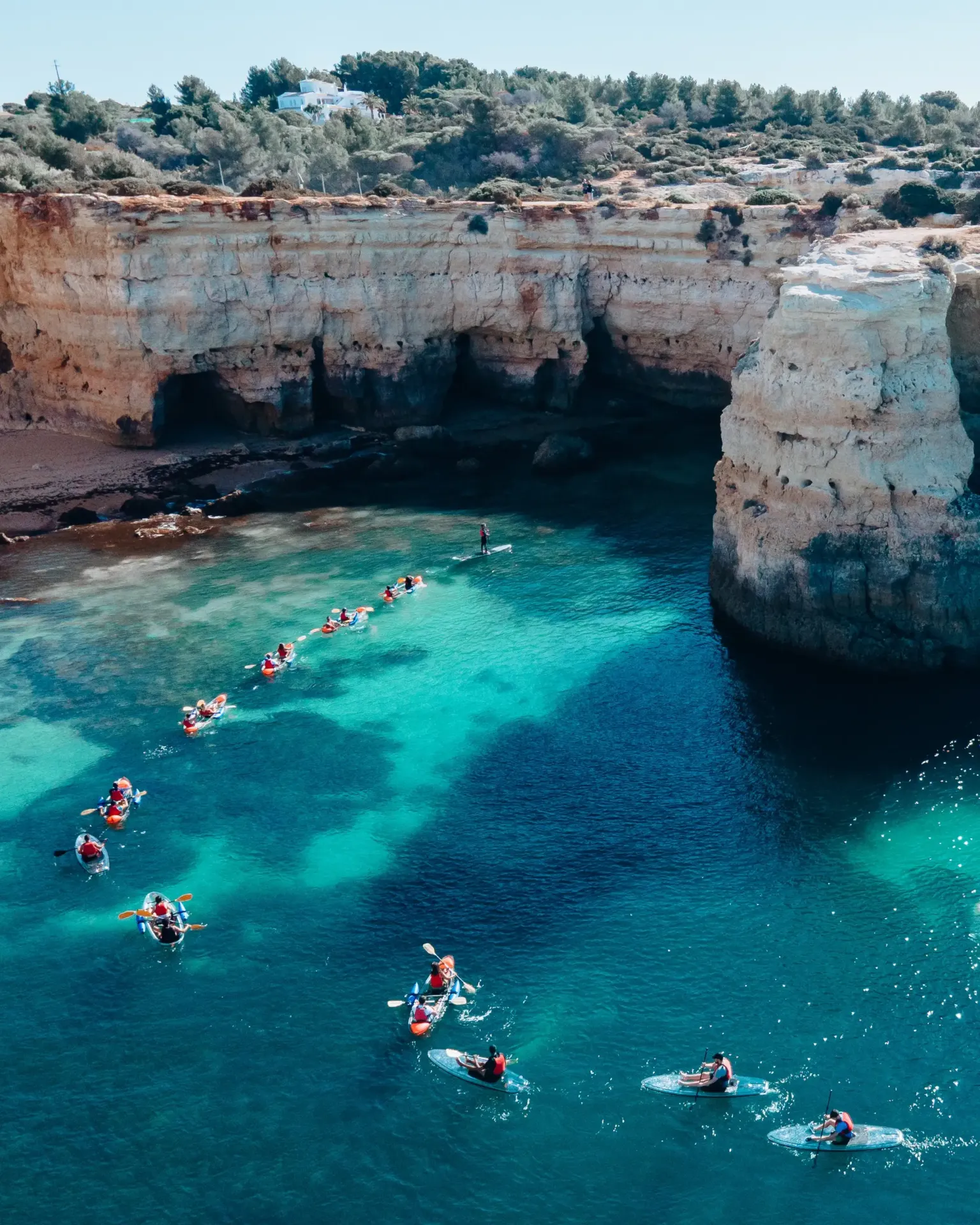 Avventura in SUP con tavola trasparente nelle grotte di Benagil