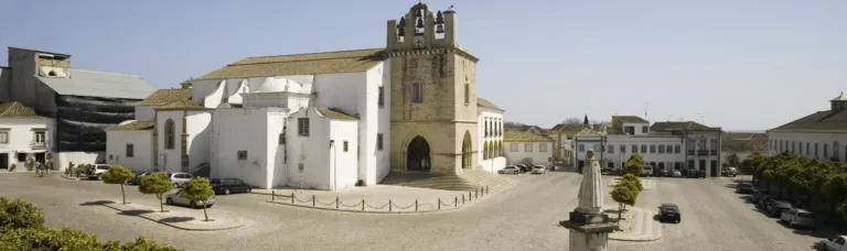 Whitewashed church and old-town square