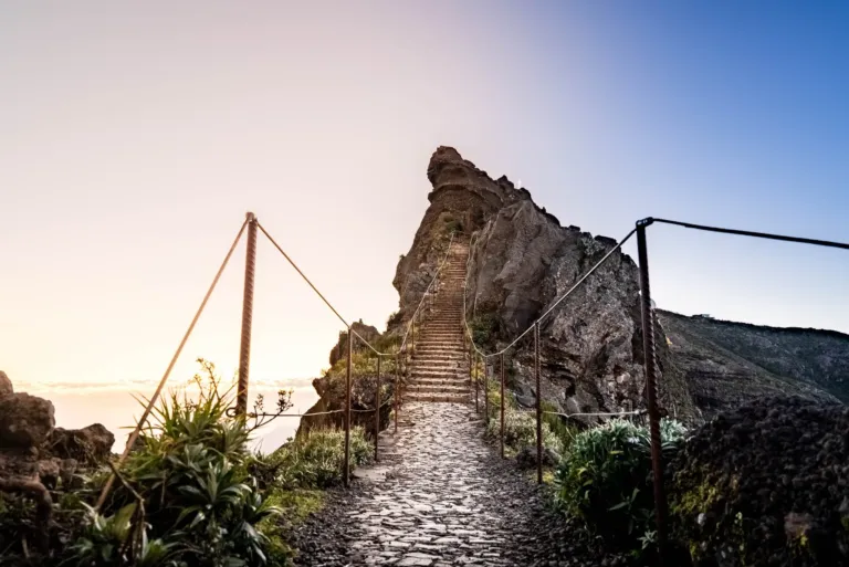 Stone stairway climbing a rocky ridge at sunrise