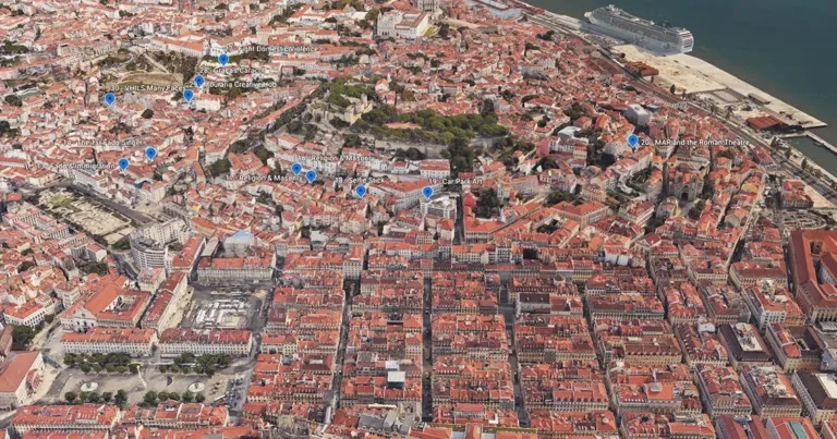 Aerial view of a dense city of red-tiled roofs