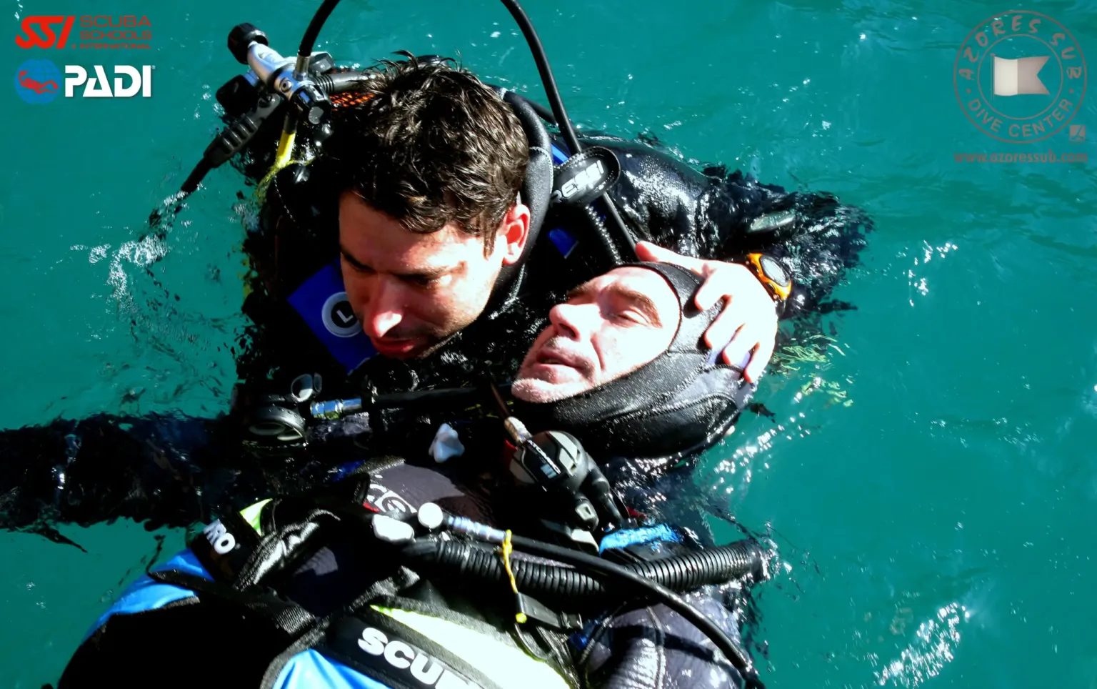 Diver assisting a casualty at the surface during a rescue exercise