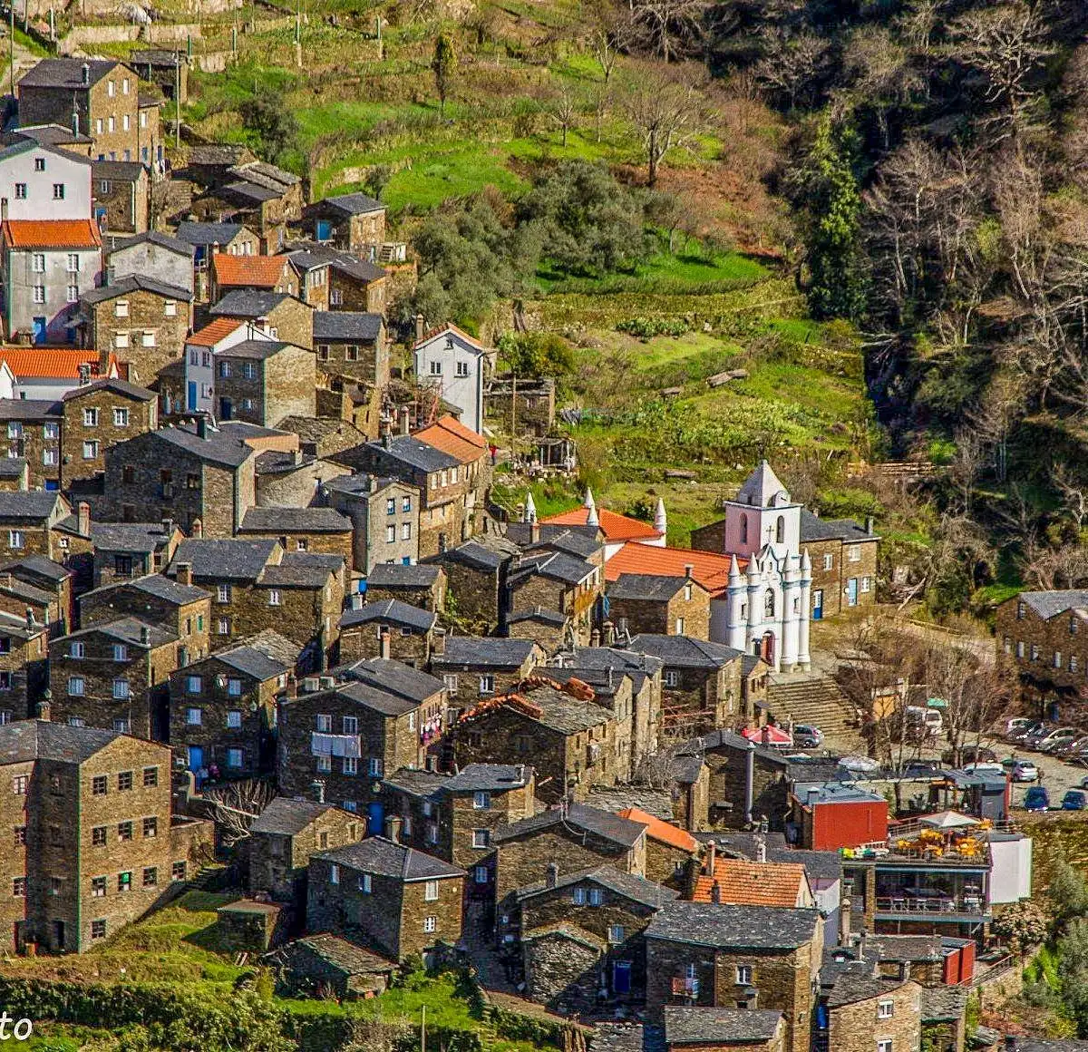 Schist-stone village built into a terraced hillside