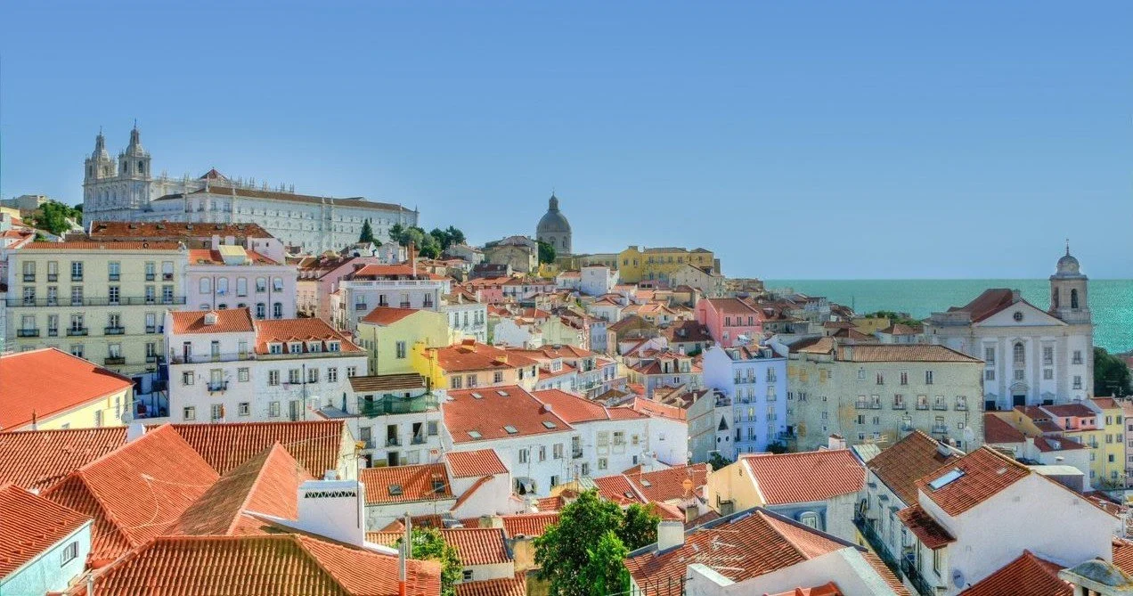 Lisbon's Alfama rooftops and the National Pantheon dome from a viewpoint