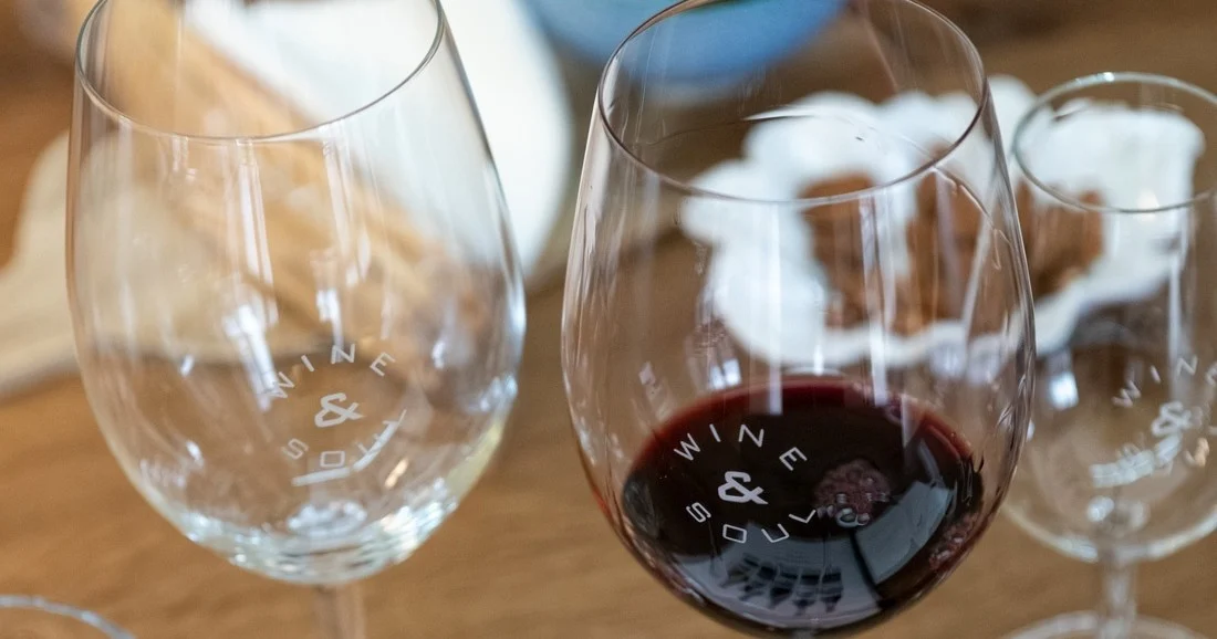 Glasses of red wine on a wooden table