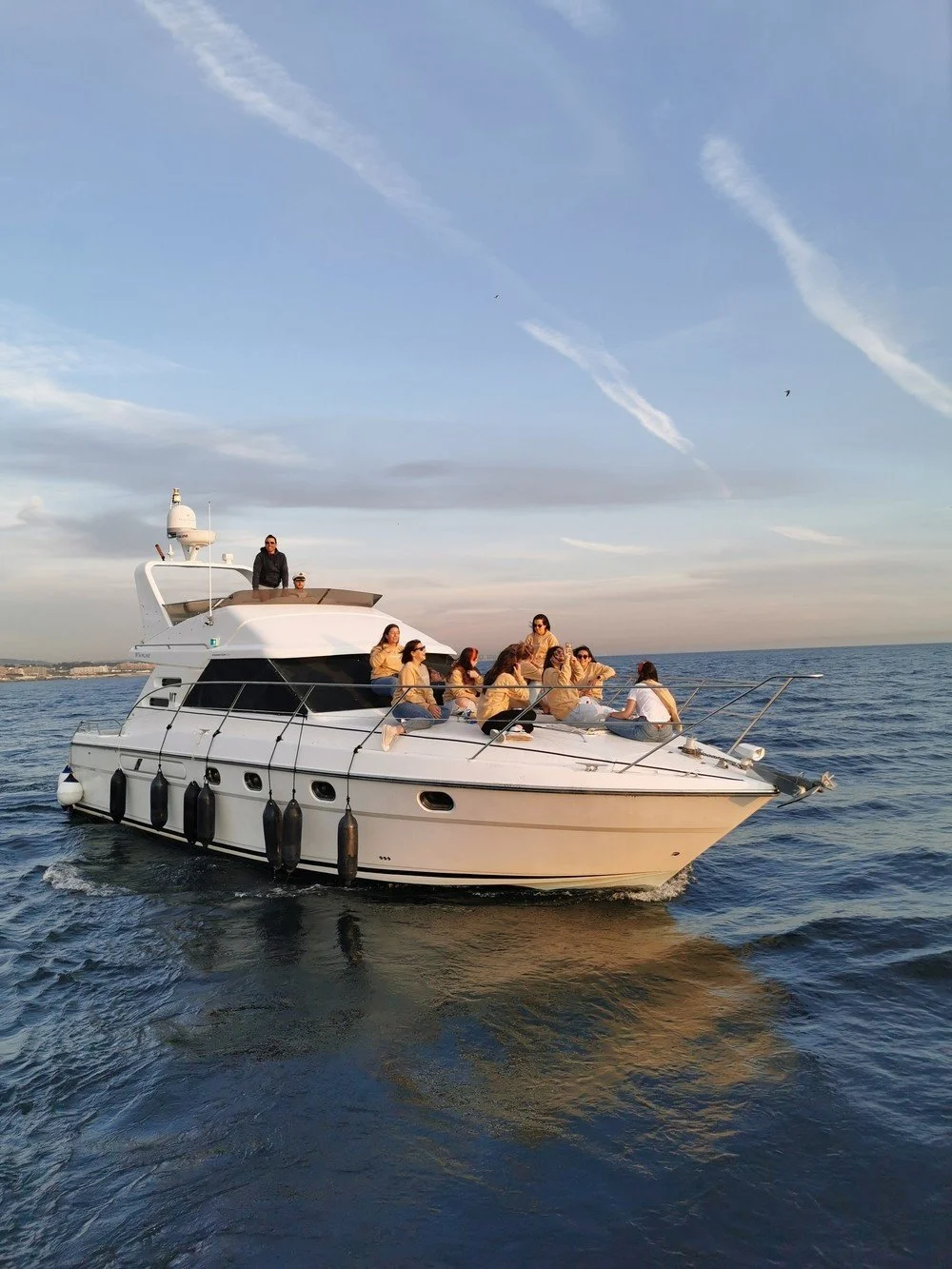 Motor yacht with guests on board on calm water
