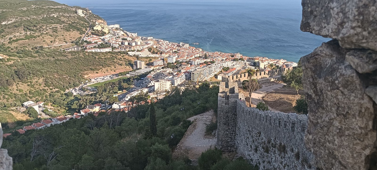 The Castle of Sesimbra standing above the village and the bay
